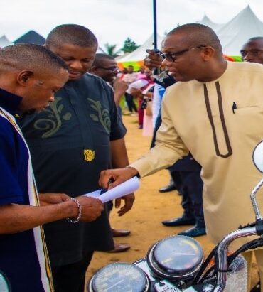Presentation of empowerment item to beneficiaries by Dr. Uwem E. Ite of Oriental Energy Resources Ltd and Engr. Emmanuel Inyang, Director of Petroleum Development
