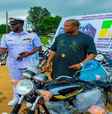 Lt. Commander Samuel Olowookere representing the Commanding officer, FOB Ibaka, presenting to one of the beneficiaries of Mbo community.